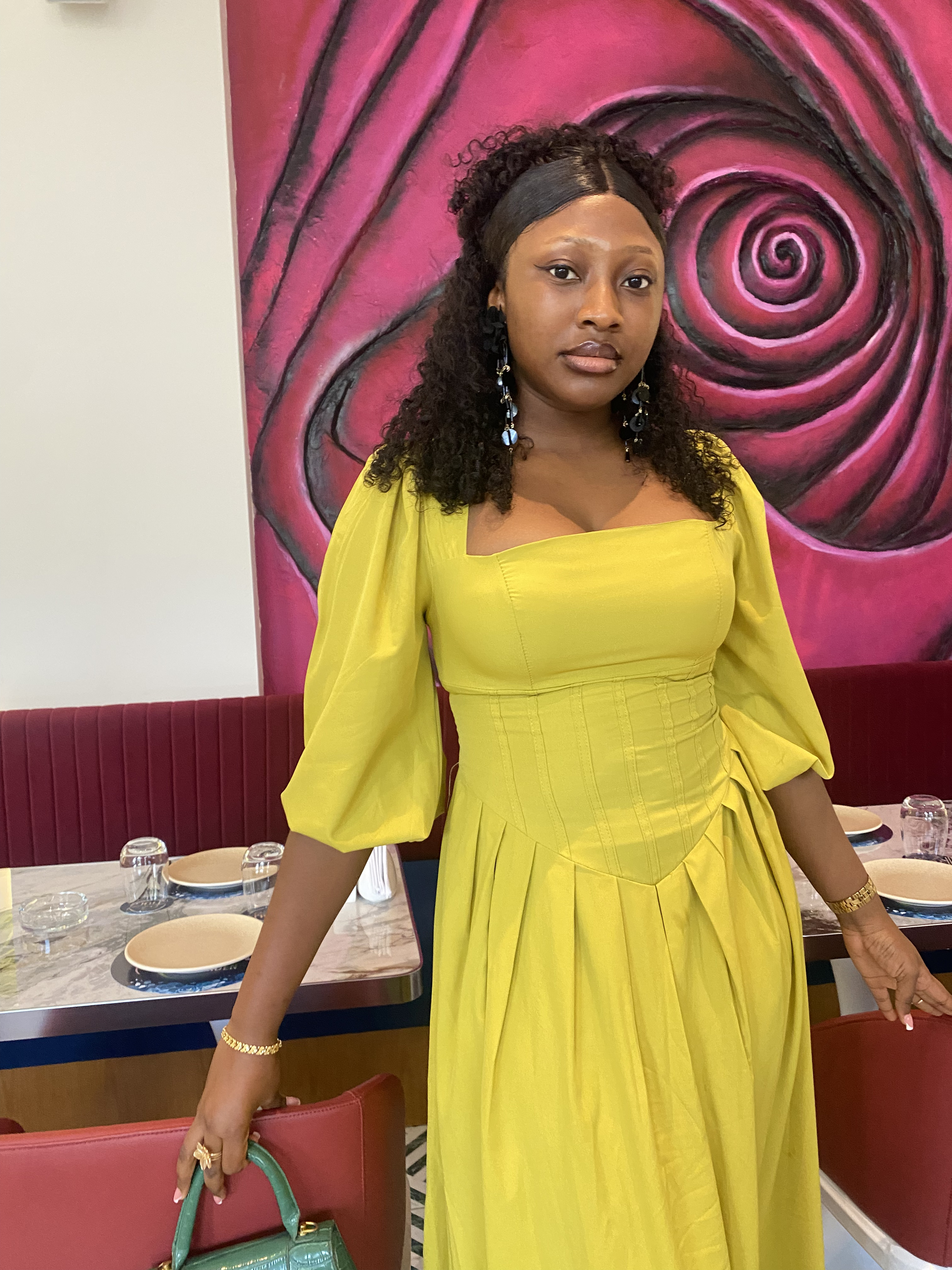 Precious in a yellow dress at dinner